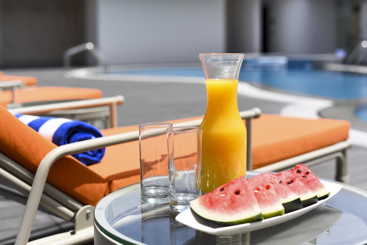 Fraser Suites Muscat Ngoại thất bức ảnh A bottle of orange juice